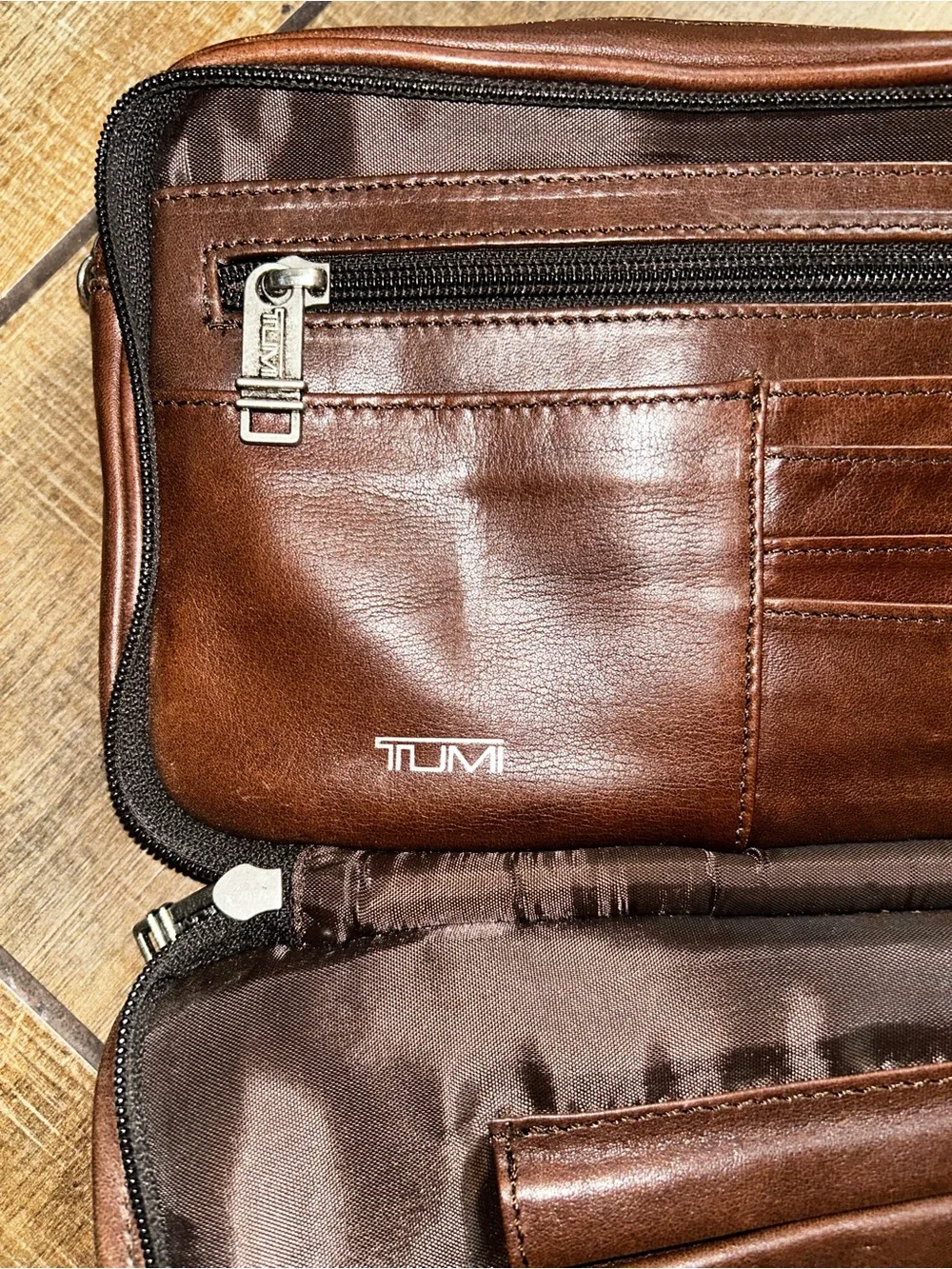 TUMI brown leather travel bag